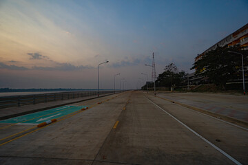 Nakhon Phanom, Thailand - February 13, 2020; Street view with beautiful sky at dawn in background