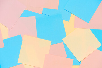 Abstract pastel background from colored note paper. Beautiful delicate background pink, yellow,...