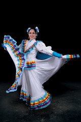 Latin woman dressed in a dress from Jalisco Mexico,