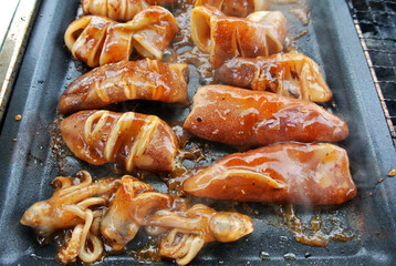 The squid is sliced and marinated with spices. Grilled on a frying pan.
