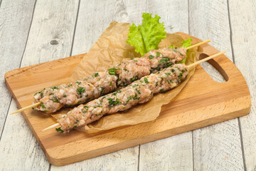 Raw minced pork skewer kebab for grill