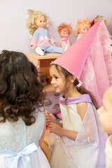 Children's performance at the festival in kindergarten. A little girl plays the role of a fairy