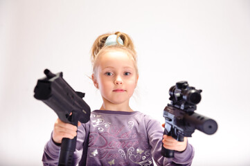 little girl with guns, in the studio