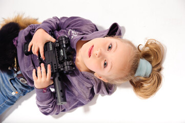 little girl with guns, in the studio