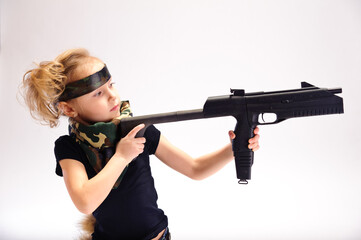 little girl with guns, in the studio