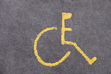 Yellow disable parking road marking on asphalt