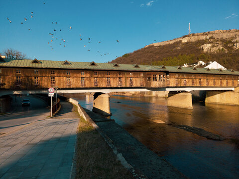 Covered wooden old bridge in traditional town of Bulgaria, Lovech over the Osam River. Build by Nikola Kolio Ficheto Fichev, a famous bulgarian architect, builder and sculptor.