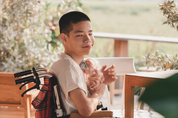 Asian disability child on wheelchair looking, talking with the girl doll in hands,Lifestyle of...