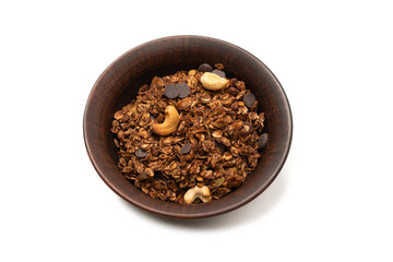 Chocolate granola cereal with nuts in a bowl background.