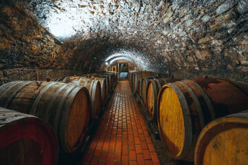 Wine barrels in a wine cellar. Small production. Underground tunnel. Storage of finished products....
