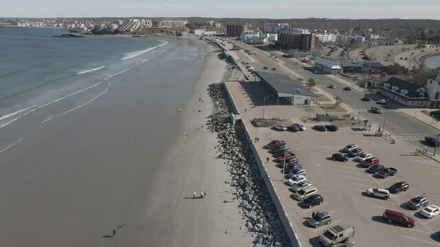 Aerial slow motion of Nantasket Beach, Hull, MA  Showing Bandstand Pavilion on the right of clip