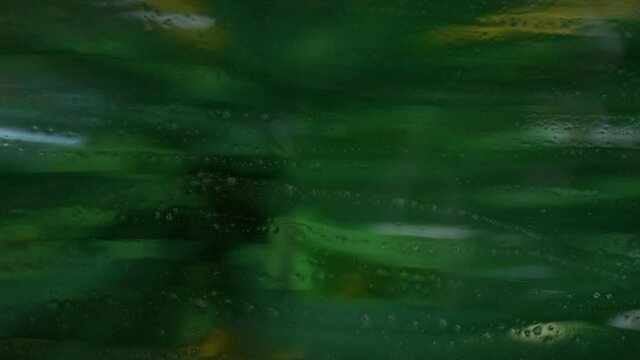 Automatic car wash brush over vehicle window. Close up