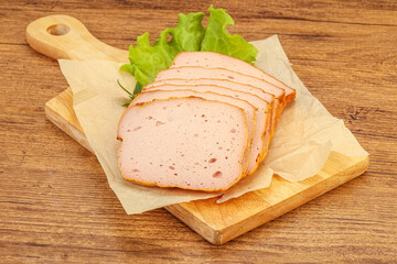 Boiled pork sausage over board