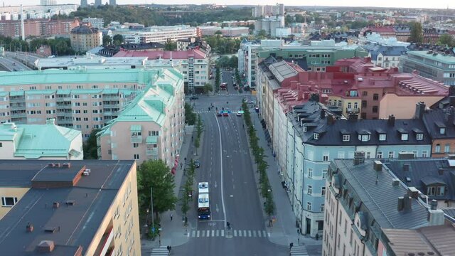 S&ouml;dermalm rooftops and buses, Stockholm summer evening aerial view