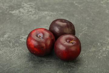 Ripe sweet plum fruit heap