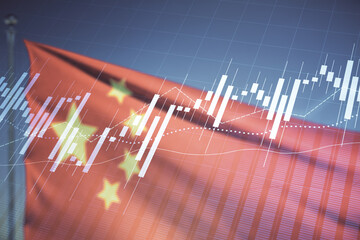 Multi exposure of virtual creative financial chart hologram on Chinese flag and blue sky...