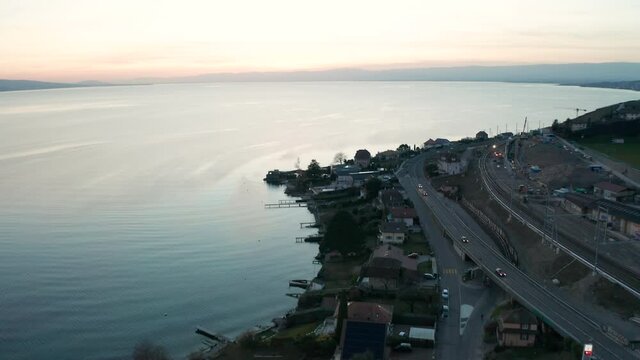 Aerial reveal of large lake near small town