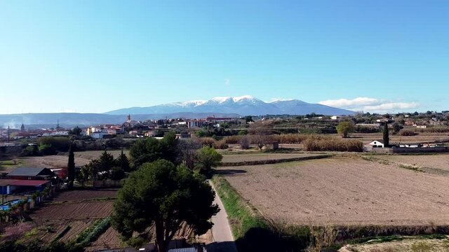 Drone aerial view of Moncayo snow mountain in Spain rotating to the right
