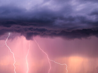 thunderstorm sky with lightning during the golden hour