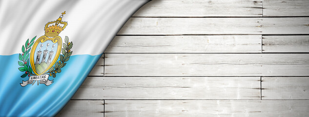 San Marino flag on old white wall banner