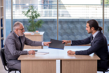 Two businessmen discussing business project