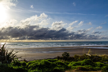 Waves and black sand highlight a visit to the beach. Taranaki, Beach, Taranaki, New Zealand..