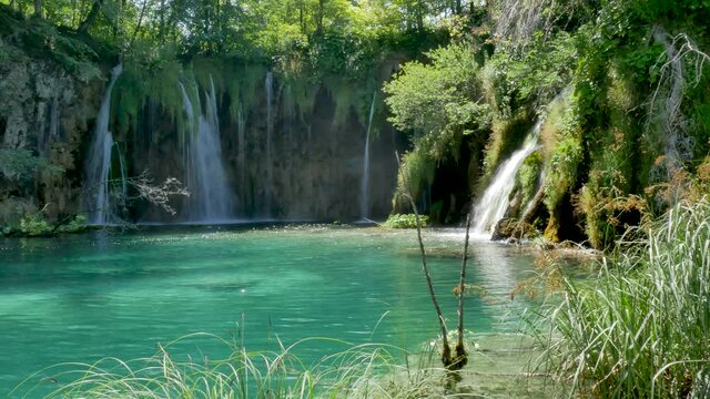 Majestic view on waterfall with turquoise water in the Plitvice Lakes National Park, Croatia. Europe. One of the oldest and largest national parks in Croatia. UNESCO World Heritage