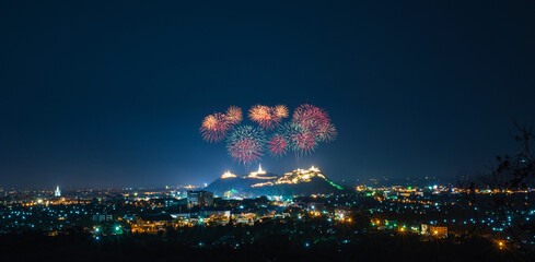 Firework sparkling in dark sky on temples over the hills at Phra Nakhon Khiri, Khao Wang, Phetchaburi, Thailand. Khao Wang fireworks Festival