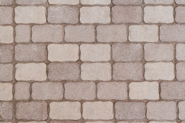 Obraz premium The pavement is made of complex paving stones.