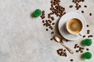 Espresso cup, fruit marmalade and fresh roasted coffee grains with copy space