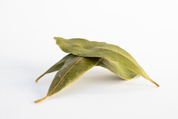 three dried bay leaves isolated