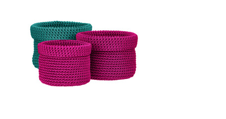 Colorful hand-woven fabric baskets isolated white background 