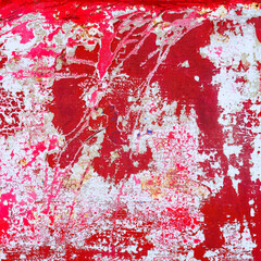 Cracked the surface of red color from the surface of the metal. Grunge metal background.