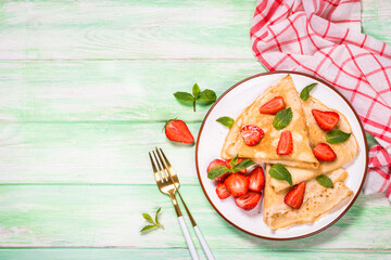 Crepes with fresh srawberries and honey.