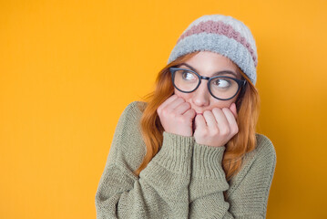 Worried young woman. Girl biting fingernail, she know the secret, isolated on white background