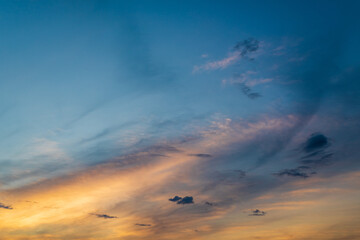 Naklejka na ściany i meble Colorful cloudy sky at sunset. Beautiful color transitions. Abstract background of nature.