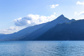 Water and mountain panorama summer view of Mont Dent du Chat on Lake Bourget Aix les bains town...