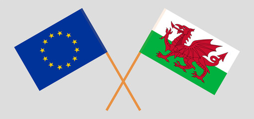 Crossed flags of the European Union and Wales. Official colors. Correct proportion