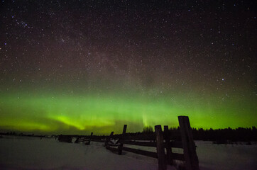 Fototapeta na wymiar Aurora borealis and starry sky. Frosty night 