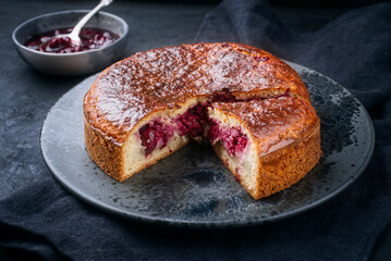 Modern style traditional French gateau basque shortcrust pastry cake with cherry jam vanilla cream...