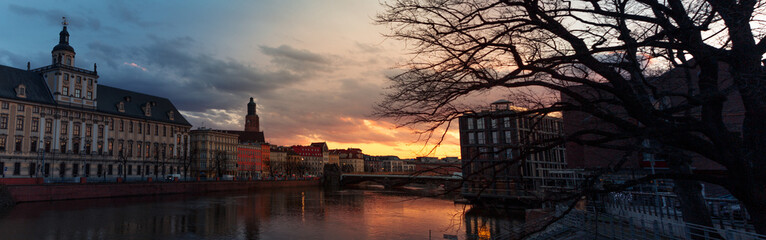 beautiful sunset over the river and the old city of wroclaw in poland