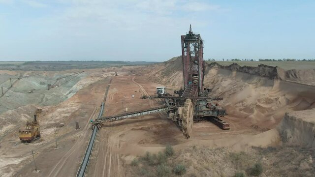 A large bucket-wheel rotary excavator. Manganese ore mining. 