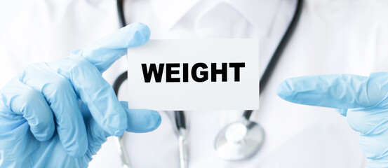 Weight text on card in hands of Medical Doctor