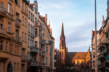 Fototapeta na wymiar view of the beautiful evening street of wroclaw with a tower in poland