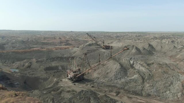 Excavators in a quarry. Manganese ore mining. 