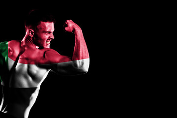 Sudan flag on handsome young muscular man