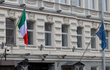 Italian and european union flags with building fasade in Saint Petersburg, Russia