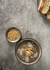 cream soup of champignons on a gray background