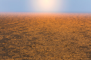 USA, Washington State, Seabeck. Smoke-filled sunset reflected on Hood Canal waters.