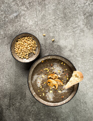 cream soup of champignons on a gray background